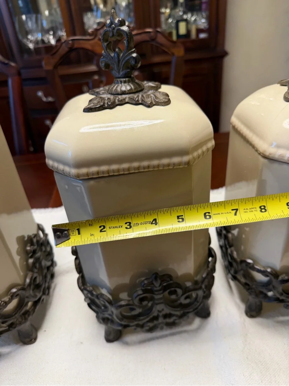 GG Collection Cream Ceramic Canister Set with Ornate Metal Accents